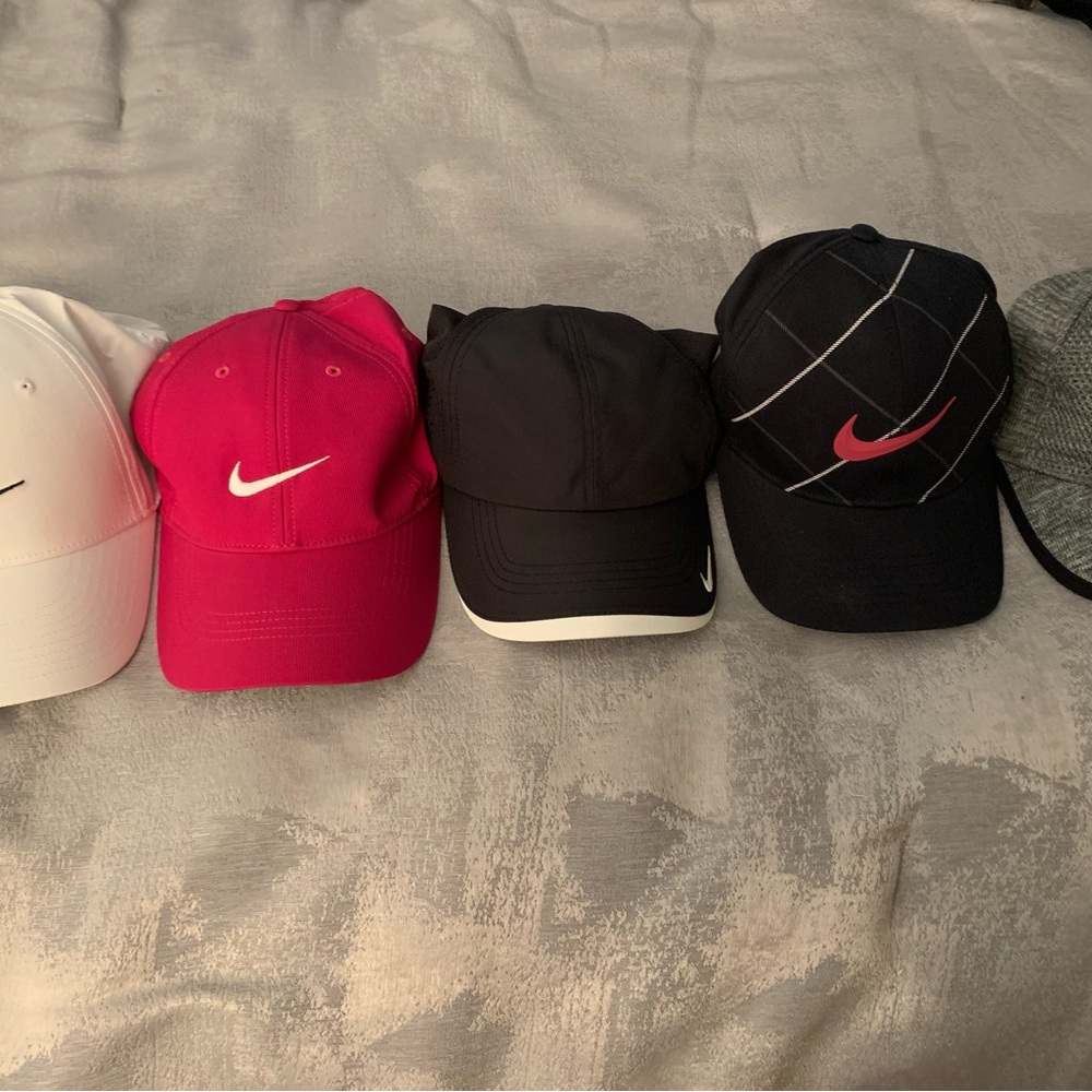 Nike Caps in White, Pink, and Black
All 5 included